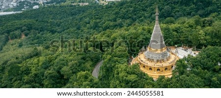 Aerial view of Phra Maha Chedi Tripob Trimongkol (Stainless Pagoda) on Kho Hong mountain, Hatyai, Songkhla, Thailand.