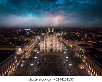 Aerial view of Piazza Duomo in front of the Duomo di Milano cathedral during heavy storm and lightening in Milan.