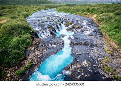 Aerial view of picturesque landscape of Bruarfoss waterfall flowing from Bruara river on wilderness in summer at Southwest of Iceland