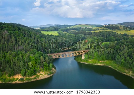Aerial view of Pilchowicki bridge - old steel truss railway bridge over the Pilchowickie Lake in Lower Silesia, Poland
