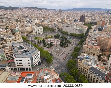 Aerial view of Placa Catalunya in Barcelona, Spain. This square is considered to be the city center and some of the most important streets of Barcelona meet there. Birds eye of Plaza Catalunya.