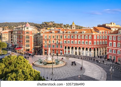 Aerial view of Place Massena square with red buildings  and fountain in Nice, France - Shutterstock ID 1057186490