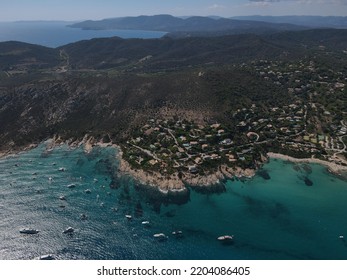 Aerial View Of Plage Ranc And Cap Taillat In French Riviera, Near Saint-Tropez. Beautiful Rocky Beach Near Coastal Path With Luxury Yachts, Turquoise And Idyllic Water. Drone View From Above France.