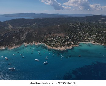 Aerial View Of Plage Ranc And Cap Taillat In French Riviera, Near Saint-Tropez. Beautiful Rocky Beach Near Coastal Path With Luxury Yachts, Turquoise And Idyllic Water. Drone View From Above France.