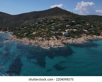 Aerial View Of Plage Ranc And Cap Taillat In French Riviera, Near Saint-Tropez. Beautiful Rocky Beach Near Coastal Path With Luxury Yachts, Turquoise And Idyllic Water. Drone View From Above France.