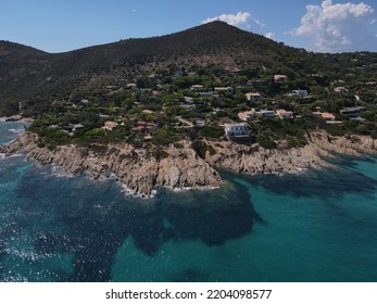 Aerial View Of Plage Ranc And Cap Taillat In French Riviera, Near Saint-Tropez. Beautiful Rocky Beach Near Coastal Path With Luxury Yachts, Turquoise And Idyllic Water. Drone View From Above France.