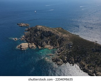 Aerial View Of Plage Ranc And Cap Taillat In French Riviera, Near Saint-Tropez. Beautiful Rocky Beach Near Coastal Path With Luxury Yachts, Turquoise And Idyllic Water. Drone View From Above France.