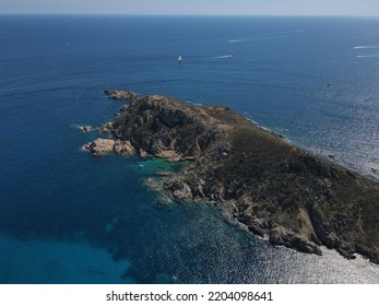 Aerial View Of Plage Ranc And Cap Taillat In French Riviera, Near Saint-Tropez. Beautiful Rocky Beach Near Coastal Path With Luxury Yachts, Turquoise And Idyllic Water. Drone View From Above France.