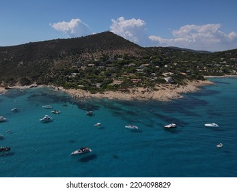 Aerial View Of Plage Ranc And Cap Taillat In French Riviera, Near Saint-Tropez. Beautiful Rocky Beach Near Coastal Path With Luxury Yachts, Turquoise And Idyllic Water. Drone View From Above France.