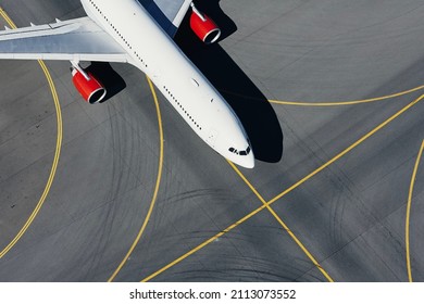 Aerial view of plane at airport. Airplane taxiing to runway before take off.	
 - Powered by Shutterstock