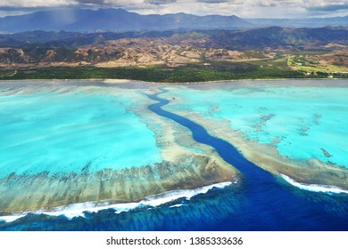 Aerial View of Poe corals reef and mountains in New Caledonia Island - Powered by Shutterstock