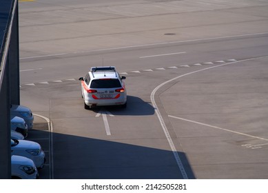 Aerial View Of Police Car At Zürich Airport On A Sunny Spring Day. Photo Taken March 26th, 2022, Zurich, Switzerland.