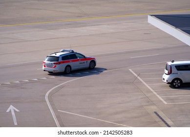 Aerial View Of Police Car At Zürich Airport On A Sunny Spring Day. Photo Taken March 26th, 2022, Zurich, Switzerland.