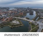 Aerial view of polygonal bastions and water filled moat protecting Copenhagen Christiania neighborhood during sunset