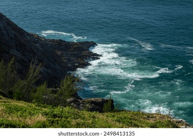 Aerial view of Pontal do Atalaia coastal rock formations with Atlantic Ocean blue waters waves breaking over the rocks under summer morning in Arraial do Cabo, Rio de Janeiro - Brazil - Powered by Shutterstock