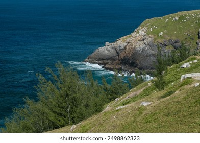 Aerial view of Pontal do Atalaia coastal rock formations with Atlantic Ocean blue waters waves breaking over the rocks under summer morning in Arraial do Cabo, Rio de Janeiro - Brazil - Powered by Shutterstock