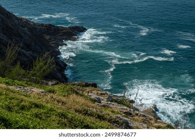 Aerial view of Pontal do Atalaia coastal rock formations with Atlantic Ocean blue waters waves breaking over the rocks under summer morning in Arraial do Cabo, Rio de Janeiro - Brazil - Powered by Shutterstock