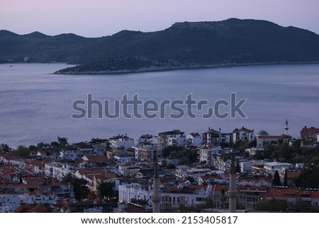 Aerial view of popular resort city Kas in Turkey. Sea bay, mountains and city buildings. Turkish Riviera or Turquoise coast.