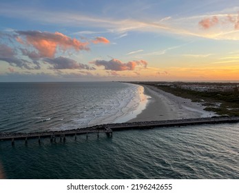 An Aerial View Of  Port Canaveral At Sunset During A Cruise Ship Sail Away In Florida.