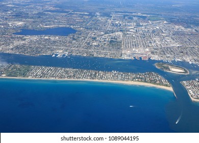 Aerial View Of The Port Of Palm Beach, Florida With The Island Of Palm Beach And Peanut Island, As Well As The Palm Beach Inlet.