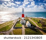 Aerial view of Portland Bill Lighthouse, a functioning lighthouse at Portland Bill, on the Isle of Portland, Dorset, England, UK