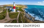 Aerial view of Portland Bill Lighthouse, a functioning lighthouse at Portland Bill, on the Isle of Portland, Dorset, England, UK
