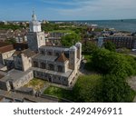 Aerial view of the Portsmouth Cathedral and the coastline. View towards the Southsea Common and Naval Memorial. Public park with green open space.