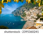 Aerial view of Positano with comfortable beach and blue sea on Amalfi Coast in Campania, Italy. Amalfi coast is popular travel and holyday destination in Europe. Ripe yellow lemons in foreground