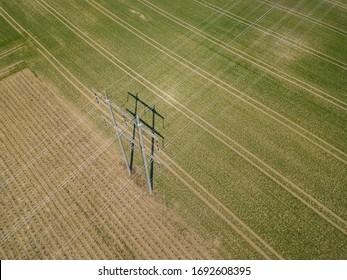 Aerial View Of Power Line Pylon With Wires. Electric Grid Network For Power Transmission In Rural Area.