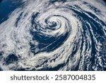 Aerial view of a powerful hurricane swirling over ocean waters. Powerful cmclone. Formation dun cyclone. Giant hurricane swirl cloud viewed from space. Elements of this image furnished by NASA