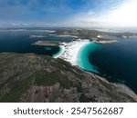 Aerial view of pristine coastline with turquoise waters and white sandy beaches in Cape Le Grand National Park, Australia.