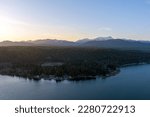 Aerial view of the Puget Sound and the Olympic Mountains at sunset in Potlatch, Washington