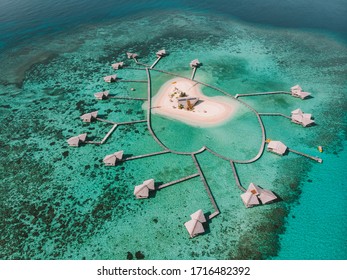 Aerial View Of Pulo Cinta Island, Indonesia. Eco House Resort Bungalow Over The Water