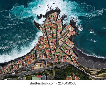 Aerial view of Punta Brava, near the town of Puerto de la Cruz on the island of Tenerife, Canary Islands, Atlantic Ocean, Spain. Drone colorful houses and black lava rocks in small fisherman village. - Shutterstock ID 2143450583