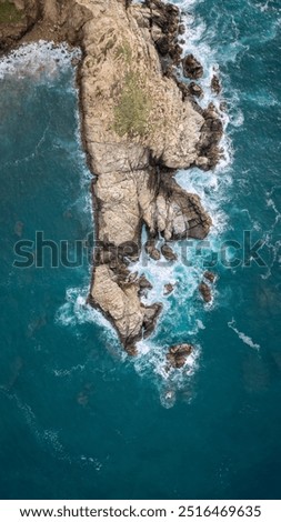 Similar – Aerial Drone View Of Dramatic Ocean Waves Crushing On Rocky Landscape