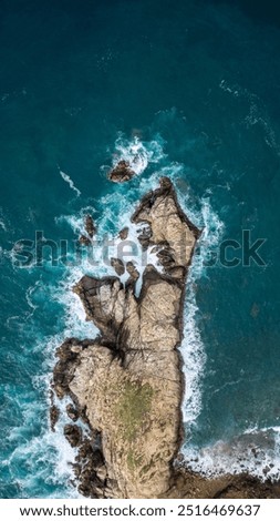 Similar – Aerial Drone View Of Dramatic Ocean Waves Crushing On Rocky Landscape