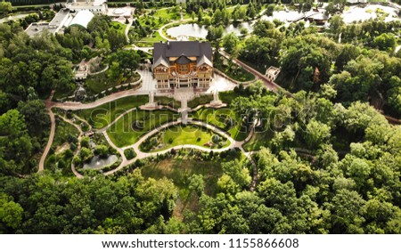 aerial view from a quadrocopter in the national park of Ukraine Mezhyhirya. luxury wooden castle house in Ukraine. residence of president.