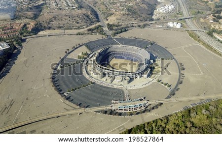 Aerial view of Qualcomm Stadium, San Diego in Southern California, United States of America and trolley line. A stadium used for concerts, the super bowl, football, baseball games and other sports.