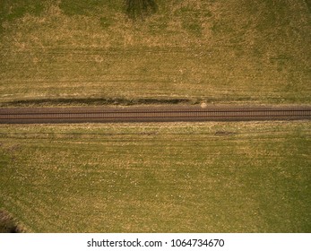 Aerial View Of Railroad Track Between Agricultural Fields In Germany 