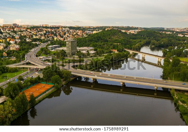 \
\
Aerial view of the railway bridge and the\
bridge for cars in Prague, which connects Prague 7 Holesovice and\
Prague 8. Beautiful view of the city in a summer day. In the\
background is Troja.