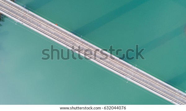 aerial view of \
railway bridge on\
reservoir