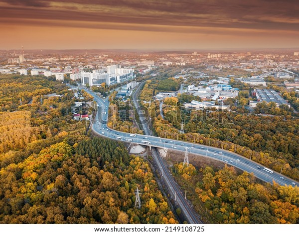 Aerial view of railway and car\
highway bridge in the city area. Transport and industry\
concept
