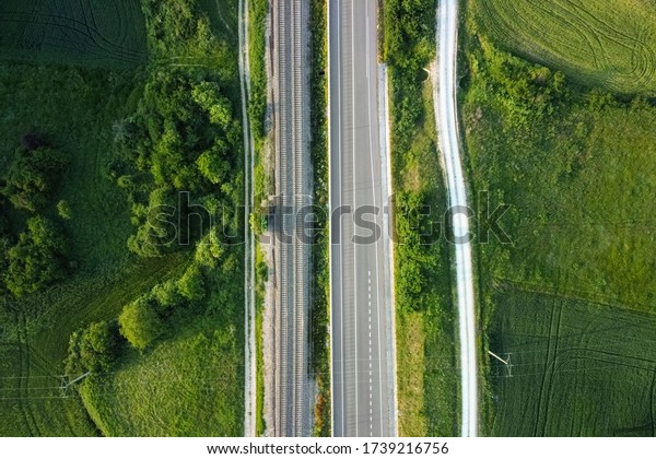 Aerial view,\
railway and road in rural landscape\
.