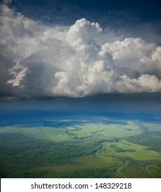 Aerial View Of The Rain Clouds Over The Forest Plain In Summer.