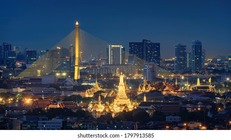 Aerial view of Rama 8 Bridge and Temple of Dawn or Wat Arun in Rattanakosin Island in architecture, Urban old town city, Bangkok skyline. downtown area, Thailand at night.