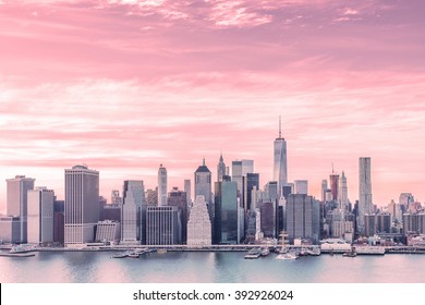 Aerial view with red filter of downtown Manhattan Skyline from Brooklyn Heights during golden hour sunset