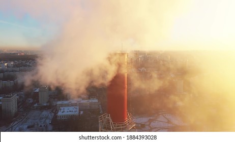 Aerial View Of A Red Smoke Stack In The City Surrounding