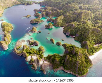 Aerial view of a remote island in Indonesia.  Piaynemo, Fam Islands, Raja Ampat, West Papua. Secret lagoon. View Point Raja Ampat Wayag.