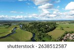 Aerial view of Repton greenery detailing river landscape and greenery , UK, featuring the River Trent, historic town architecture, green spaces, canals, and countryside in vibrant natural light.