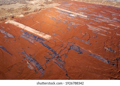 Aerial View Of A Reservoir Full Of Red Toxic Sludge. A Red Mud Storage. 